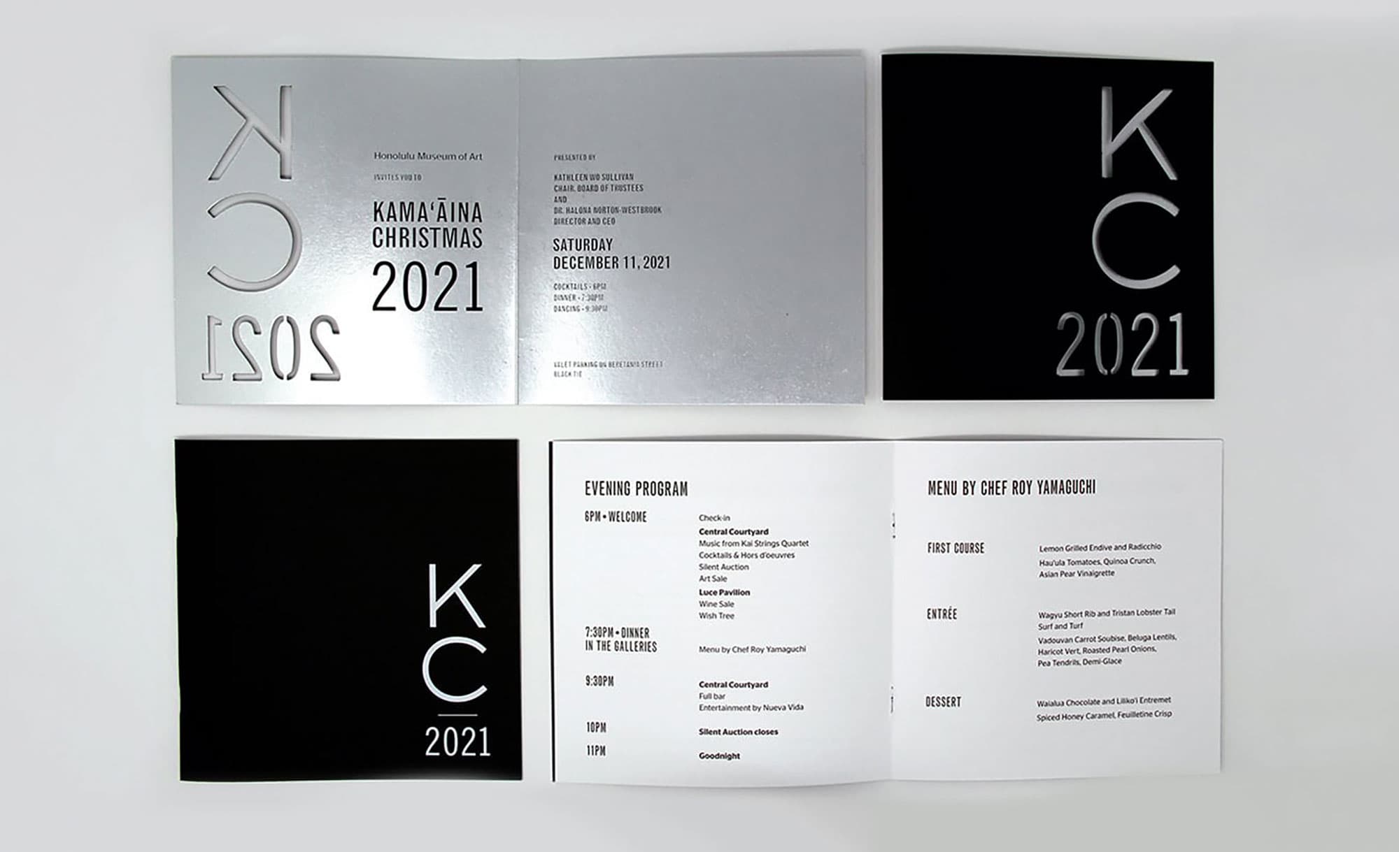 Honolulu Museum of Art Kamaaina Christmas 2021 invitation with silver foil die-cut on Epic Black Classic Crest cover and program with white foil stamp and White Cougar Text inside pages